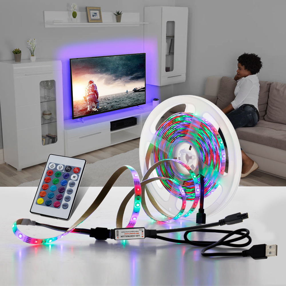 Smart RGB LED strip lighting creating neon ambience for gaming desk and monitor