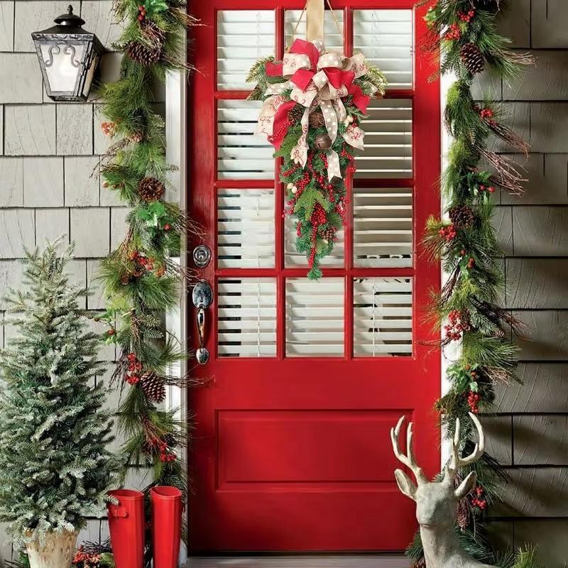 Holiday front door swag with greenery and berries