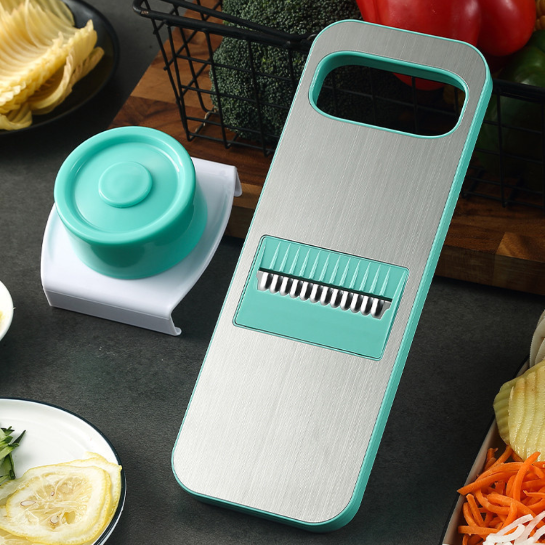 Magnetic vegetable cutter in Green – stainless steel three-knife set
Lifestyle Image: Red magnetic vegetable slicer slicing cucumbers and carrots in kitchen