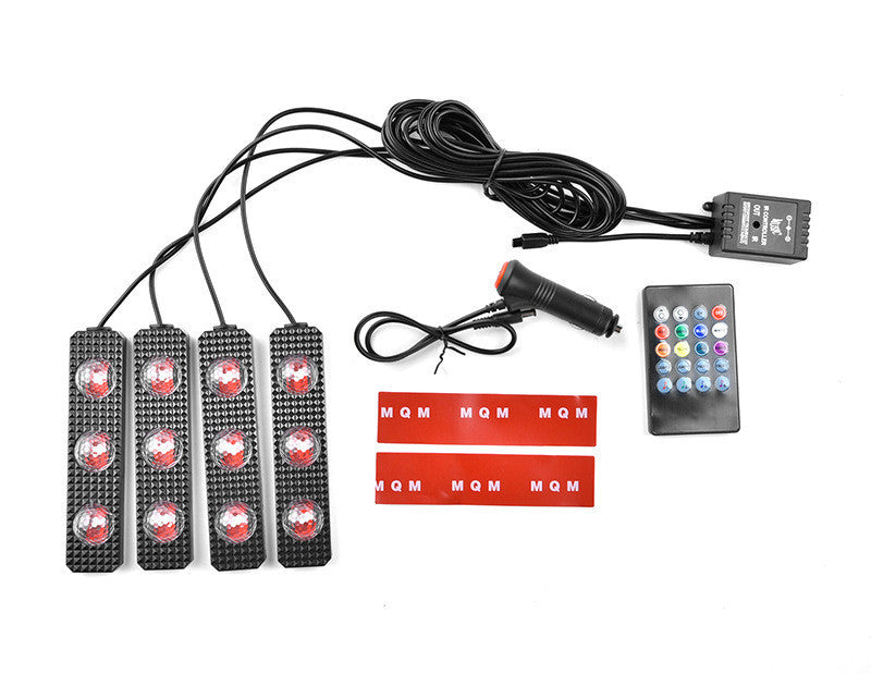 Car interior at night with RGB star footwell ambient lights installed.