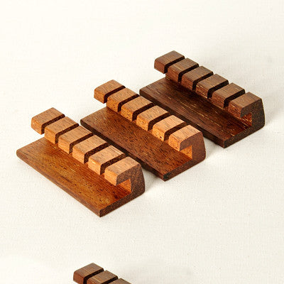 Solid wood desktop cable organizer with 6 slots for charging cables